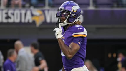 Lewis Cine warming up on the field at U.S. Bank Stadium before a Vikings game.