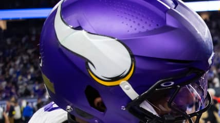 Jonathan Greenard shakes hands with Matthew Stafford after a Vikings playoff game against the Rams.