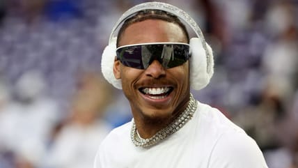 Justin Jefferson standing on the field during pregame warmups before a Vikings game.