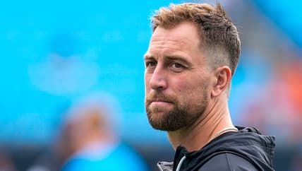 Adam Thielen warms up on the field before a game with the Panthers.