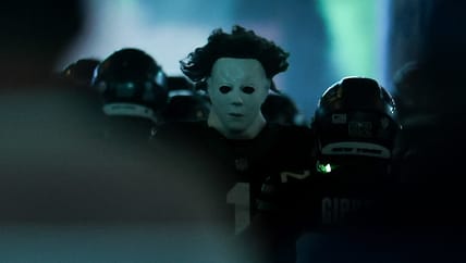 Sauce Gardner runs onto the field in a Michael Myers mask before a Jets game at MetLife Stadium.