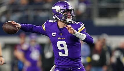 J.J. McCarthy throws a pass against the Dallas Cowboys at AT&T Stadium.
