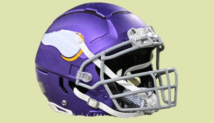 Minnesota Vikings helmet sits on the field before a game at U.S. Bank Stadium.