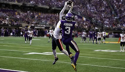 Jordan Addison battles Nahshon Wright for a contested catch against the Bears.