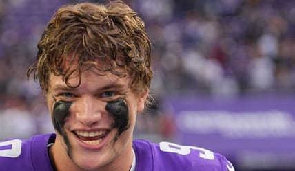 J.J. McCarthy reacts with Mike Sainristil after a game at U.S. Bank Stadium.