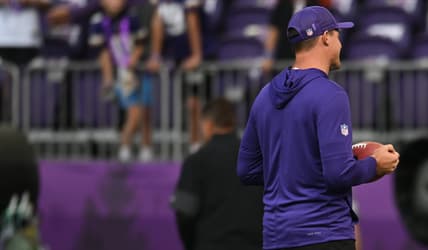 Kevin O’Connell and Zac Taylor speak on the field before a Vikings-Bengals game at U.S. Bank Stadium in Minneapolis.