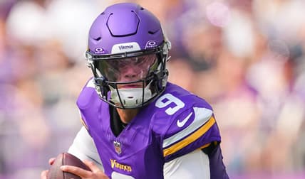 Minnesota Vikings quarterback J.J. McCarthy scrambles away from pressure against the Las Vegas Raiders during a preseason game at U.S. Bank Stadium.