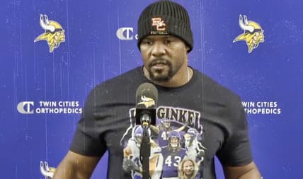 Vikings defensive coordinator Brian Flores speaks to reporters during a midweek media session.