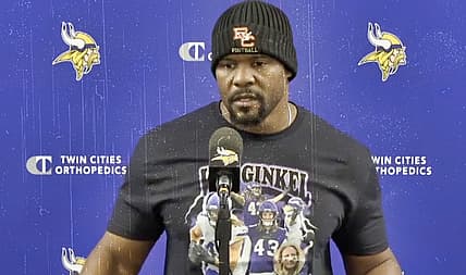 Vikings defensive coordinator Brian Flores speaks to reporters during a midweek media session.