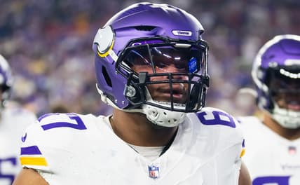 Ed Ingram lines up on the offensive line for the Minnesota Vikings during a playoff game against the Los Angeles Rams.