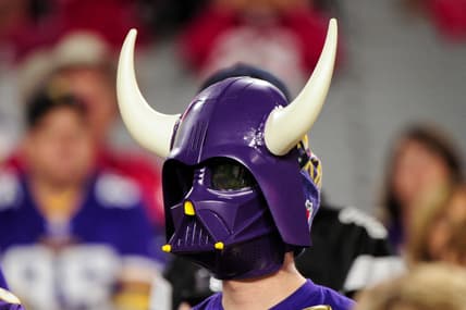 A Minnesota Vikings fan watches pregame activities before a road game against the Arizona Cardinals in Glendale, Arizona.