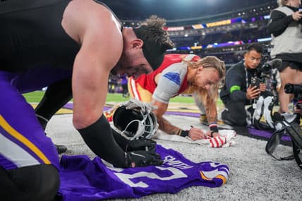 Harrison Smith signs a jersey for George Kittle after a Vikings game at U.S. Bank Stadium in Minneapolis.