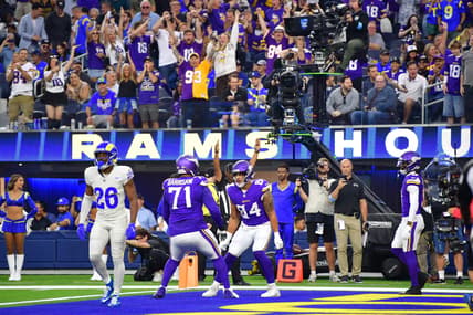 Josh Oliver celebrates a touchdown with Christian Darrisaw during the Vikings’ first-half matchup against the Rams at SoFi Stadium.