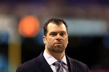 Ryan Grigson stands on the field before the Colts' AFC Wild Card game against the Bengals.