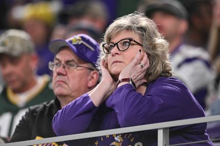 Vikings fans react in the stands during a game against the Packers at U.S. Bank Stadium