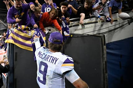 J.J. McCarthy celebrates after a Vikings road win over the Bears at Soldier Field.