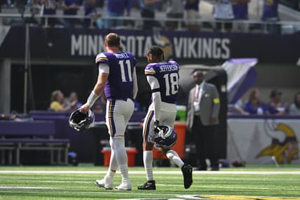 Carson Wentz and Justin Jefferson walk off the field at halftime during a Vikings game at U.S. Bank Stadium.