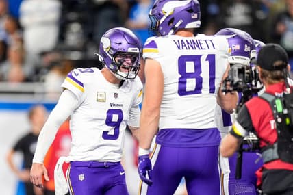 J.J. McCarthy celebrates a touchdown with Justin Jefferson against the Lions at Ford Field.