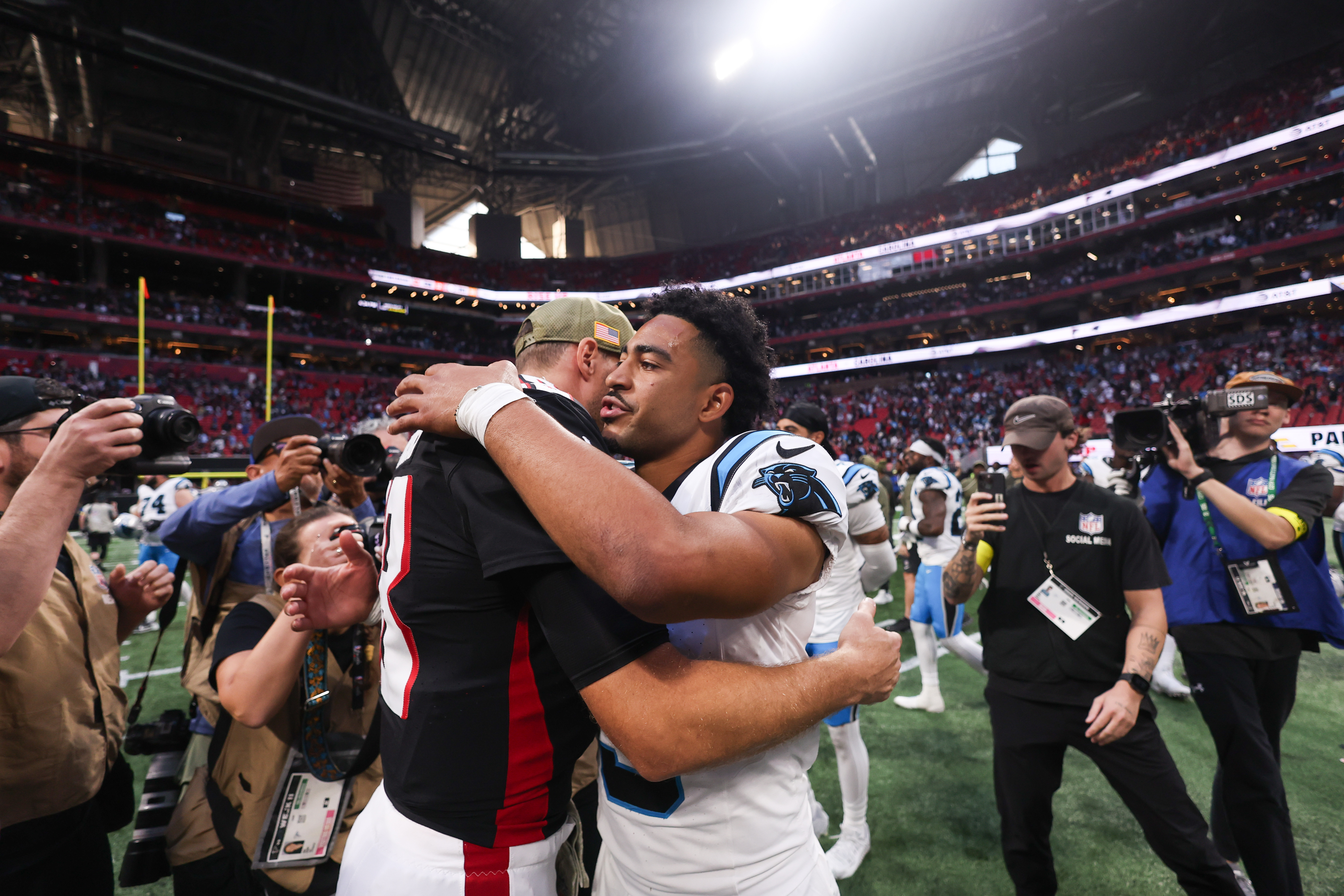 Kirk Cousins and Bryce Young in 2025 after the game.