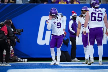 J.J. McCarthy celebrates after scoring a touchdown against the New York Giants at MetLife Stadium.