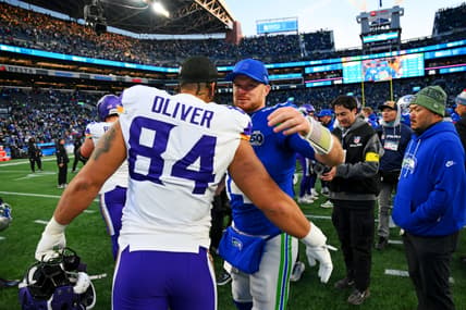 Seahawks QB Sam Darnold and TE Josh Oliver embrace in 2025