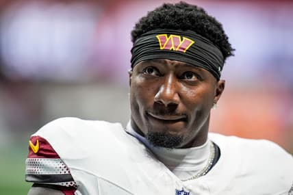 Washington Commanders wide receiver Deebo Samuel stands on the field before a game against the Atlanta Falcons at Mercedes-Benz Stadium.