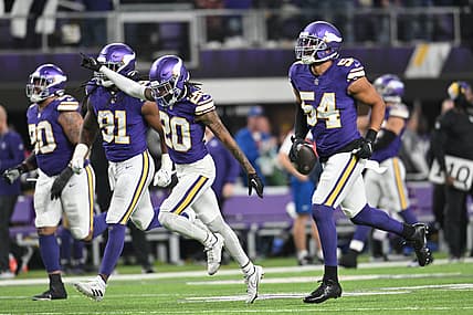 Minnesota Vikings linebacker Anthony Barr celebrates a fourth-quarter fumble recovery with Jay Ward and Pat Jones II against the Chicago Bears.