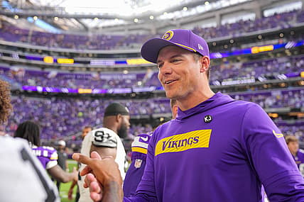Kevin O’Connell stands on the field after Vikings-Raiders preseason action.