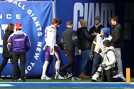 J.J. McCarthy leaves the field after an injury during a game against the New York Giants.