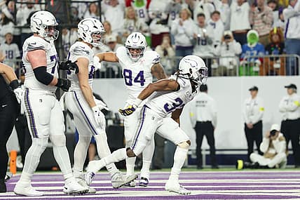 Aaron Jones Sr. celebrates after scoring a touchdown against the Lions.