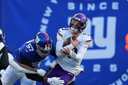 Chauncey Golston sacks J.J. McCarthy during a Vikings-Giants game.