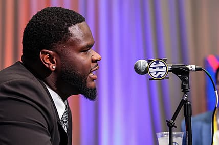 Caleb Banks answers questions from reporters during SEC Media Days in Atlanta.