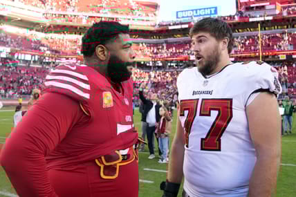 Trent Williams and Justin Skule chatting in 2023.