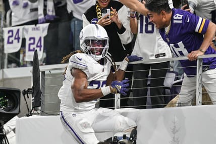 Aaron Jones celebrates a touchdown against the Bears at U.S. Bank Stadium.