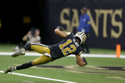 Saints wide receiver Chris Olave dives into the end zone for a touchdown against the Rams at Caesars Superdome.