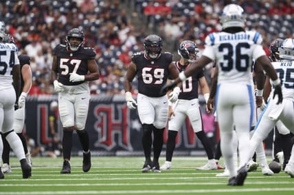Houston Texans offensive linemen Blake Fisher and Ed Ingram walk to the line of scrimmage before a preseason play against the Carolina Panthers at NRG Stadium.