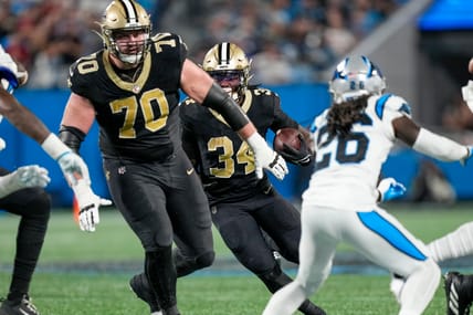New Orleans Saints lineman Trevor Penning and running back Tony Jones in 2023.