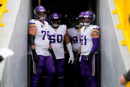 Brian O'Nei;ll and Vikings teammates at Green Bay in 2025