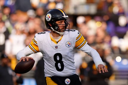 Aaron Rodgers throwing a pass during a Steelers game at M&T Bank Stadium in Baltimore.