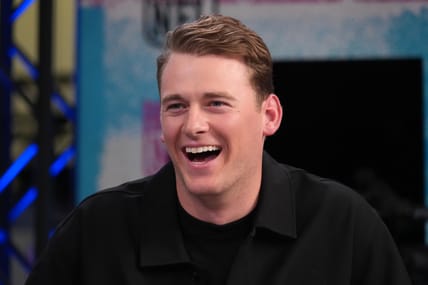 Mac Jones sits on the NFL Network set during Super Bowl media week at the Moscone Center in San Francisco.