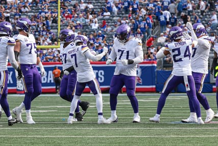 Byron Murphy Jr. and Vikings teammates celebrate defensive stop against Giants.