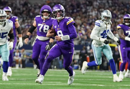 J.J. McCarthy scrambles outside the pocket during a Vikings road game against the Dallas Cowboys at AT&T Stadium.