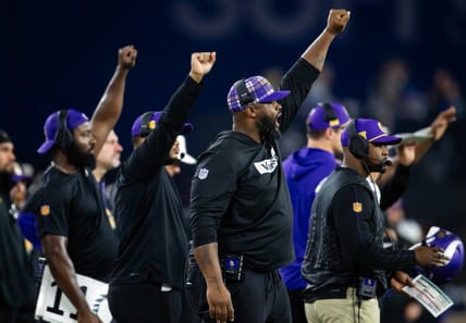 Vikings defensive line coach Marcus Dixon on sideline during NFC wild card game vs. Rams.