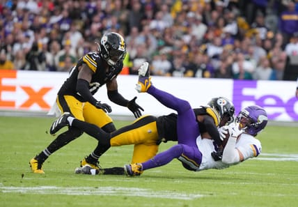 Adam Thielen is tackled by Steelers defenders during the Vikings’ International Series game in Dublin.