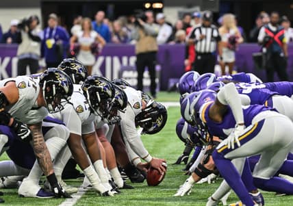 The Vikings and Ravens line up at the line of scrimmage during a game at U.S. Bank Stadium.