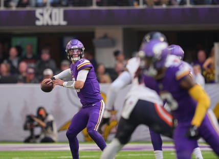 J.J. McCarthy throws a pass during a Vikings home game against the Bears.
