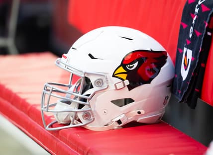 Close-up view of Arizona Cardinals helmet on sideline at State Farm Stadium.