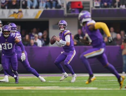 Minnesota Vikings quarterback J.J. McCarthy prepares to throw during the first quarter of a game against the Chicago Bears.
