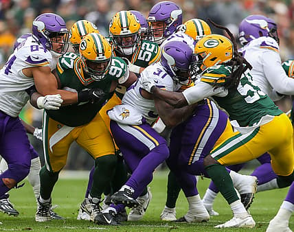 Cam Akers tackled by multiple Packers defenders during Vikings game