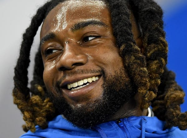 James Houston laughs with teammates before Lions game vs. Bears